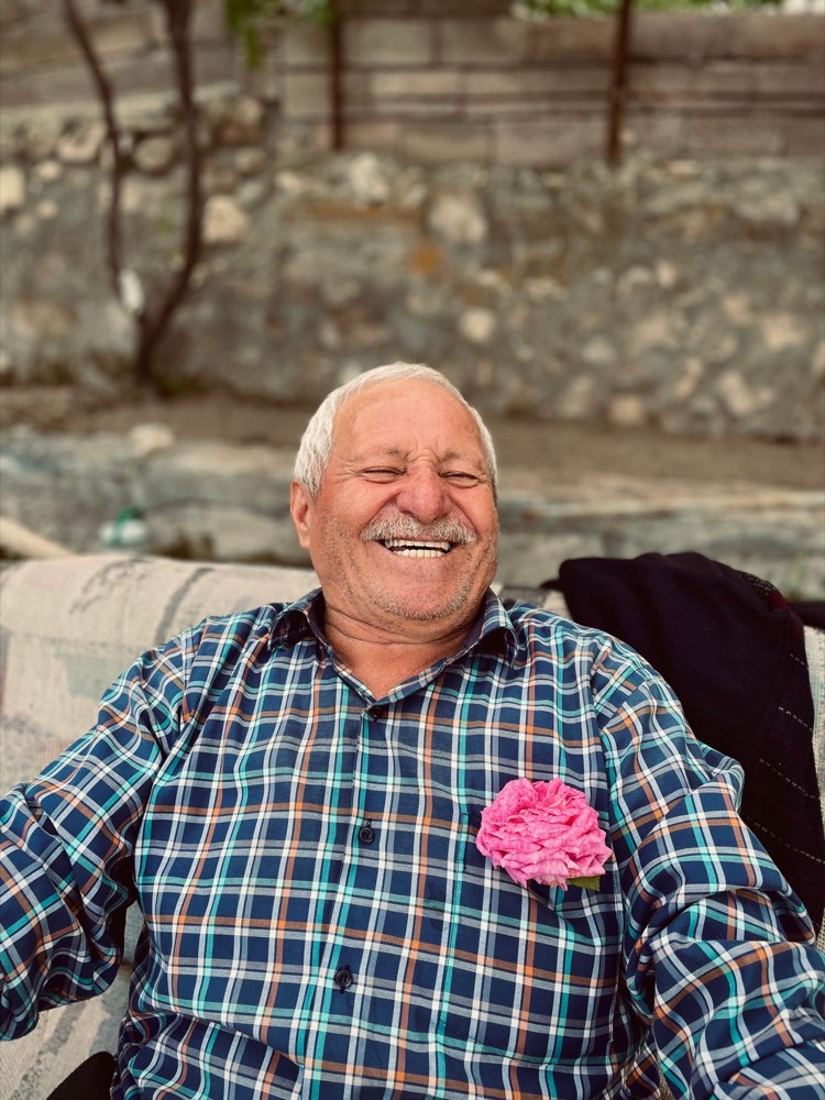 An older man laughing